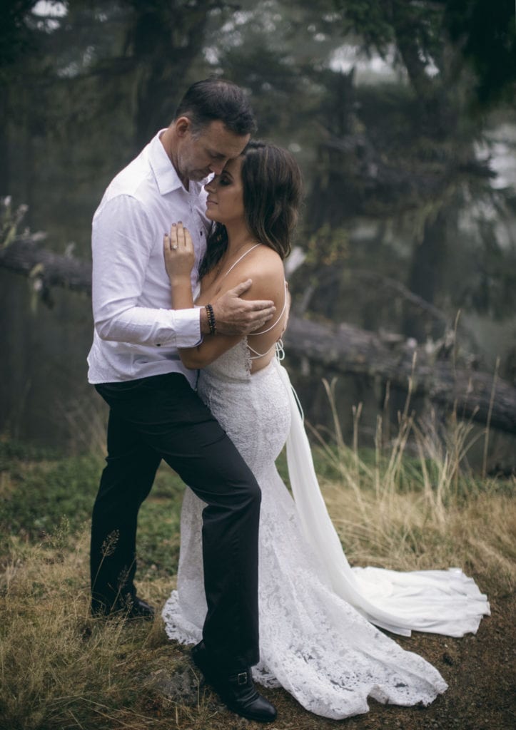 bride and groom in forest at their elopement
