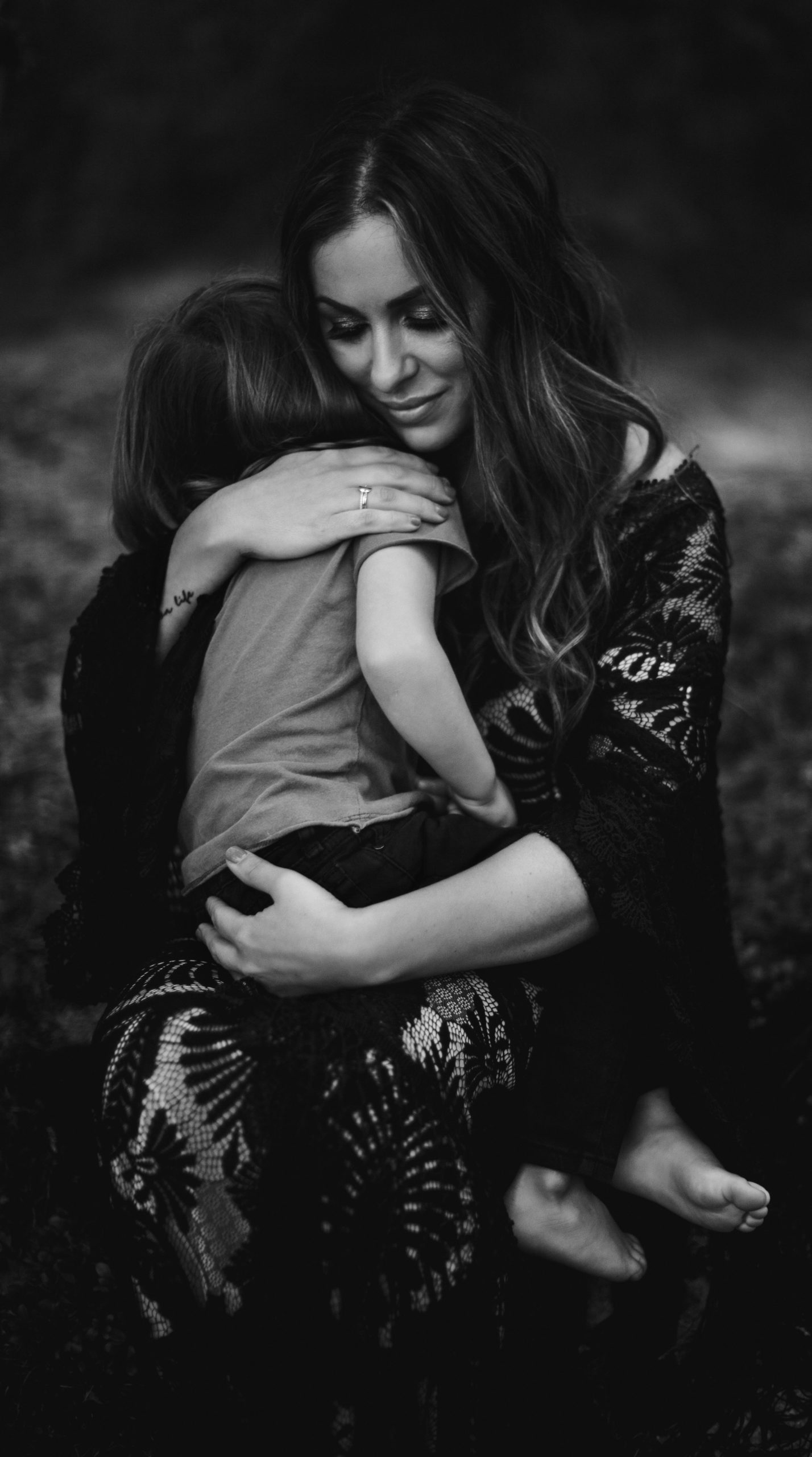 A bride in a black wedding dress eloping with kids.