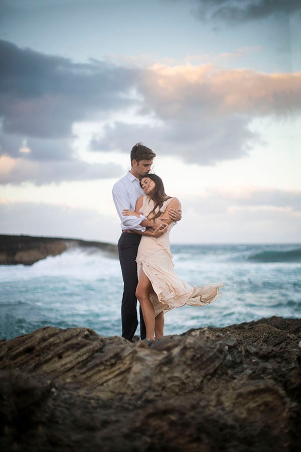 couple by the sea in Hawaii at their elopement.