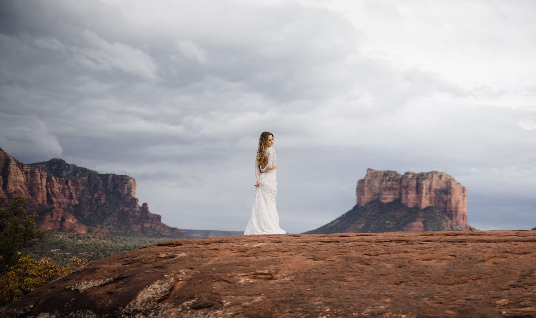 A bride in sedona in a portrait session with her elopement photographer.