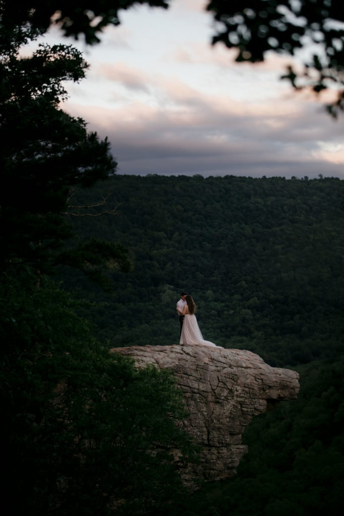 A just married couple that renewed their wedding vows on the side of a cliff at Whitaker's Point in Arkansas