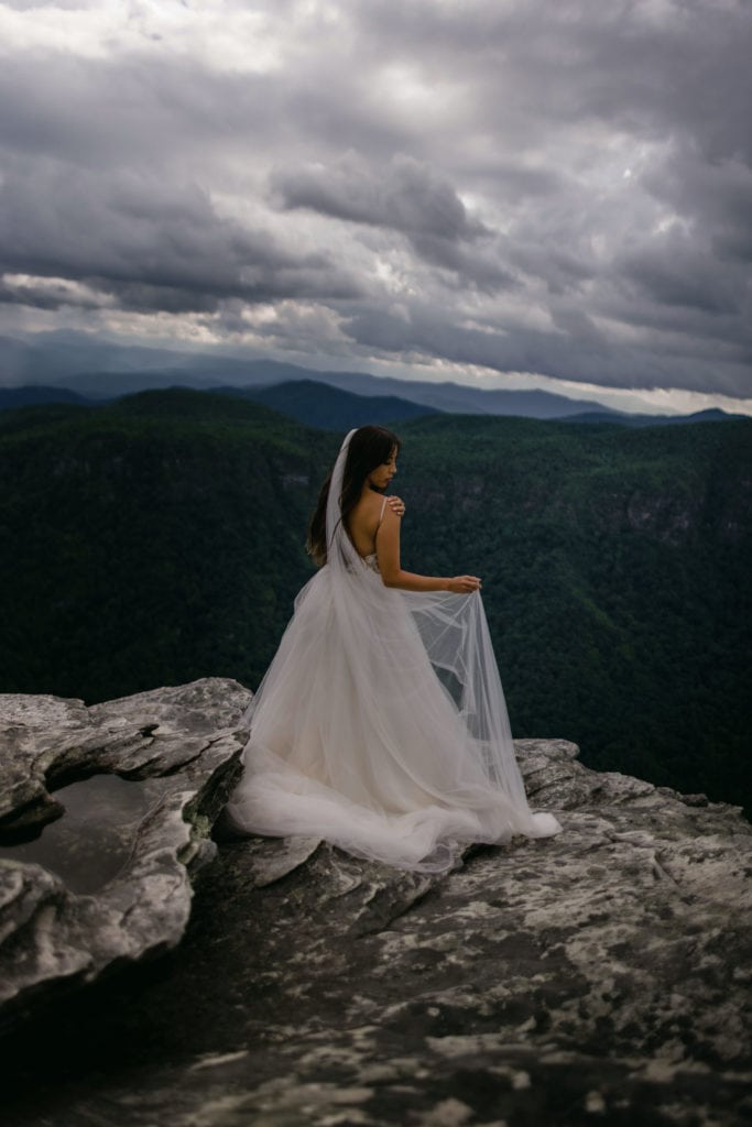 A bride in her adventure elopement photography in Asheville.