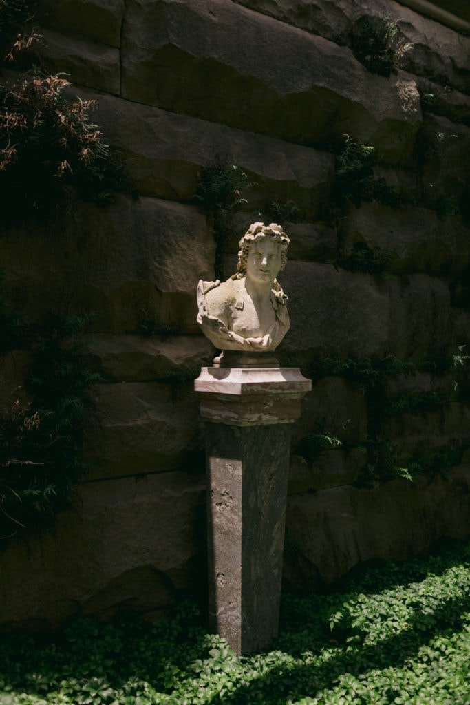 One of the many statues and busts located within the gardens at the Biltmore Estate.