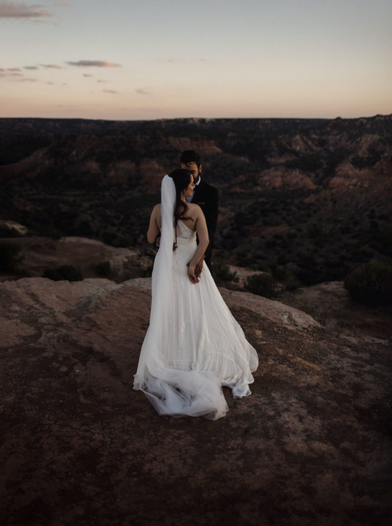 A couple in their wedding elopement photography in a canyon.