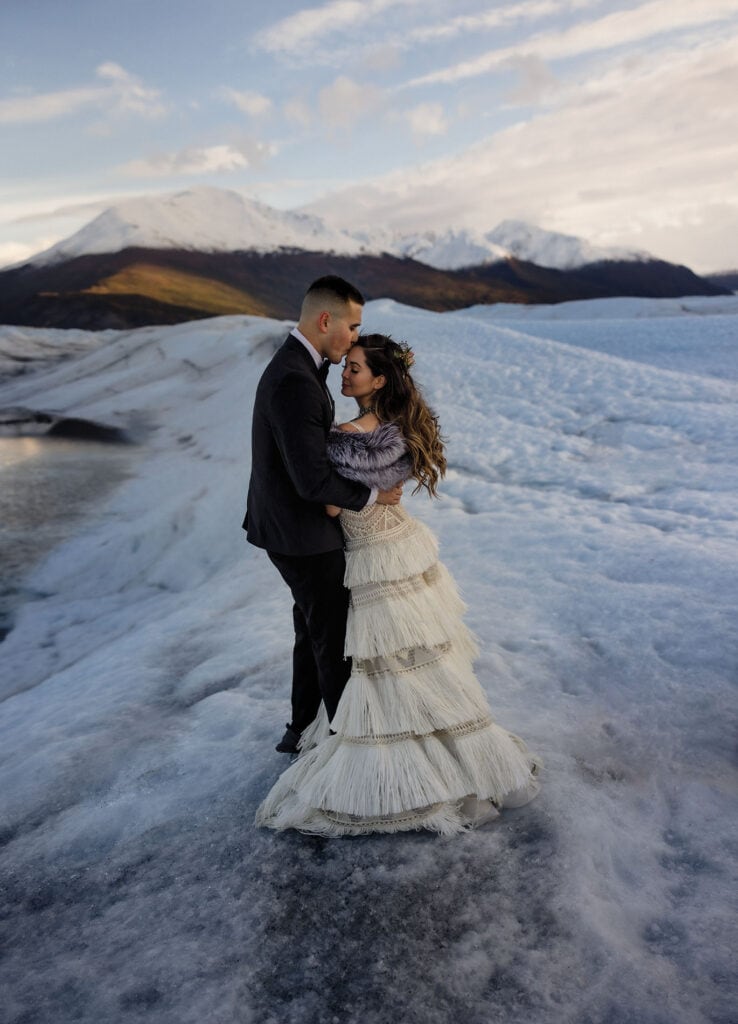 The best way to elope in Alaska is with a helicopter tour on a Glacier.