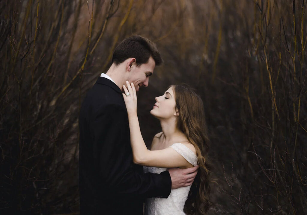A bride and groom at their Grand Teton elopement embracing.