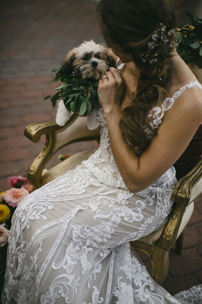 Bride with her puppy on her wedding day.